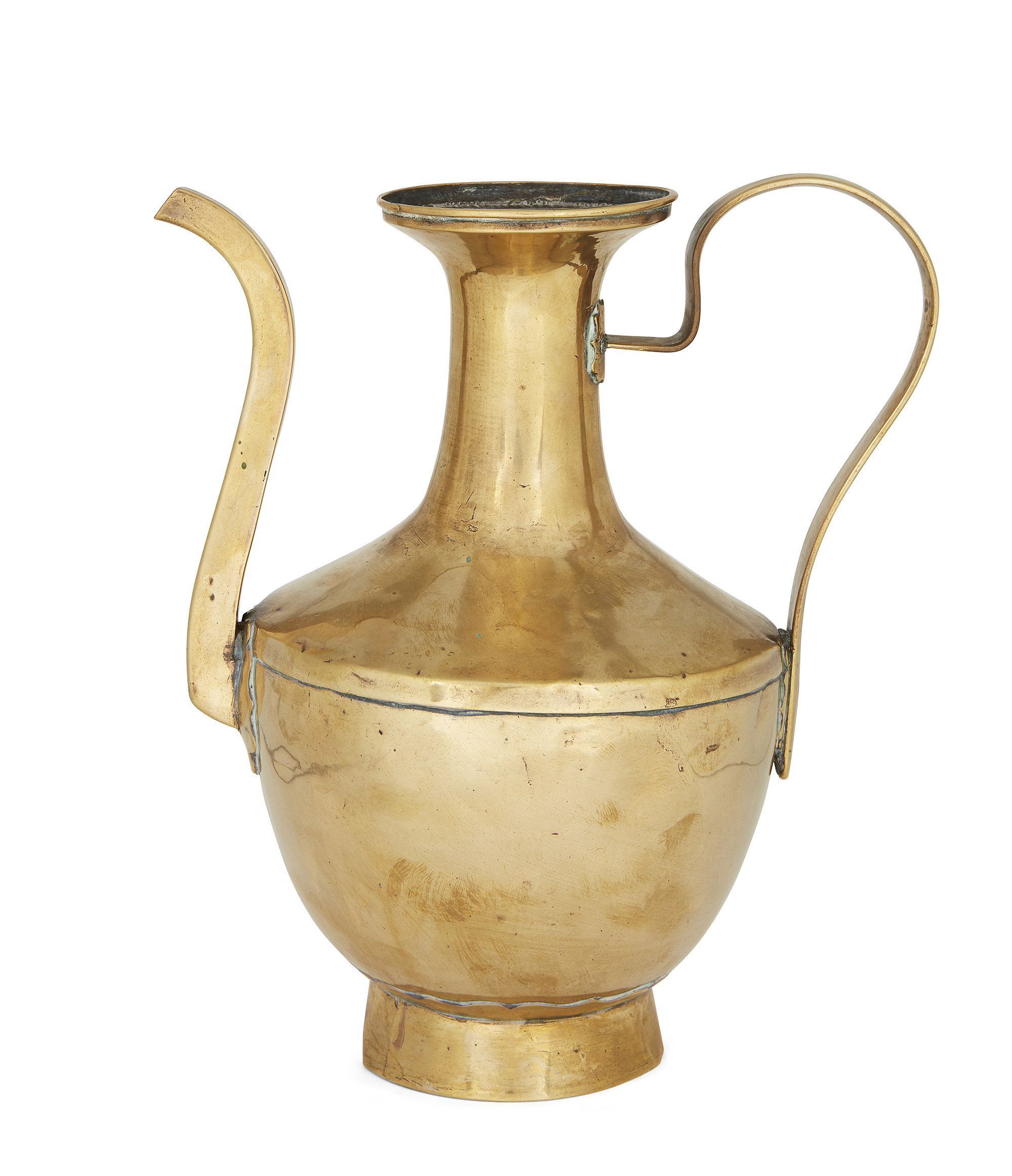 A Tibetan brass ewer, 19th century, on a raised cylinder foot, joined at the shoulder, curved fac...