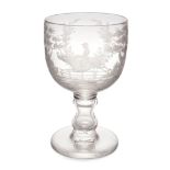 A large engraved glass goblet, 19th century, the bowl engraved with a horse racing landscape vign...
