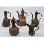 A group of Middle Eastern copper and brass pots and jugs, 20th century, of various shapes and siz...