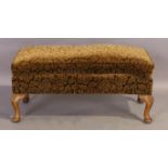An English walnut stool, of Queen Anne style, first quarter 20th century, floral velour upholster...