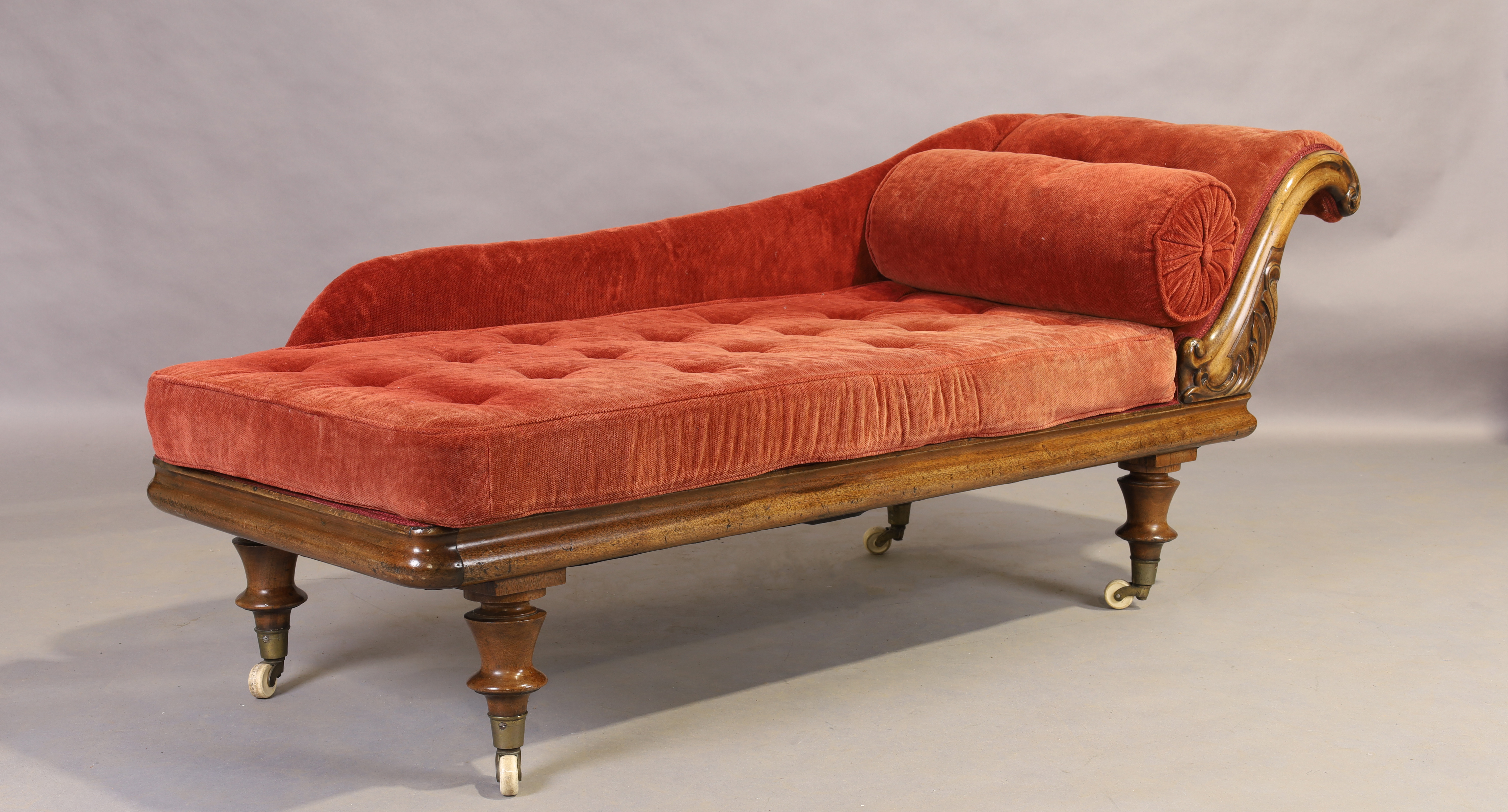 A Victorian mahogany chaise longue, third quarter 19th century, on turned legs to brass caps and ... - Image 4 of 4