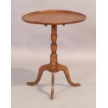 A George III fruitwood occasional table, last quarter 18th century, the circular tilt top above t...