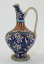 An Iznik-style pottery ewer, Qajar Iran, 19th century, with looping handle, the slender neck and ...