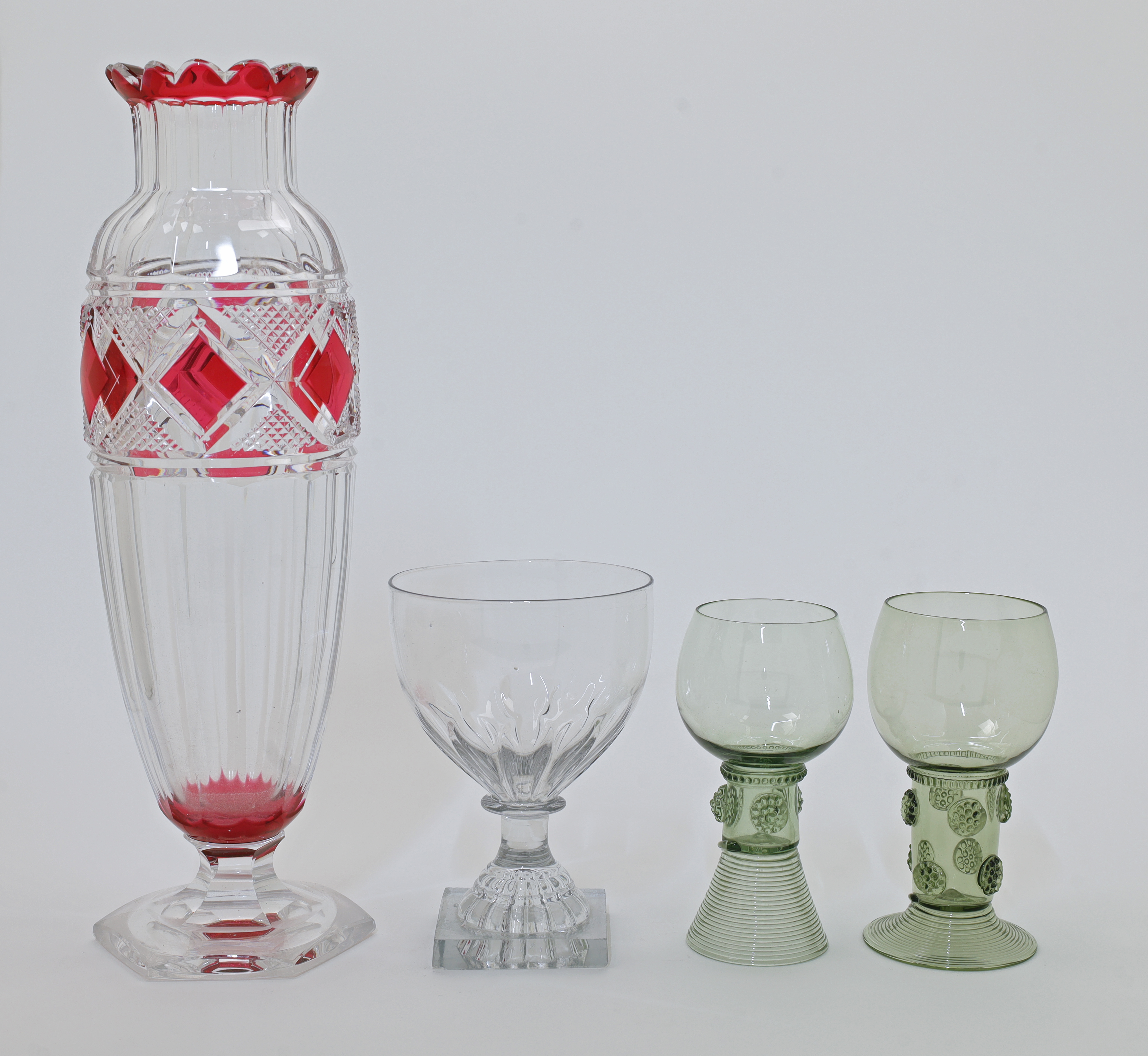 A group of glassware, probably 19th century, comprising: two green roemer glasses, the cup bowls ...