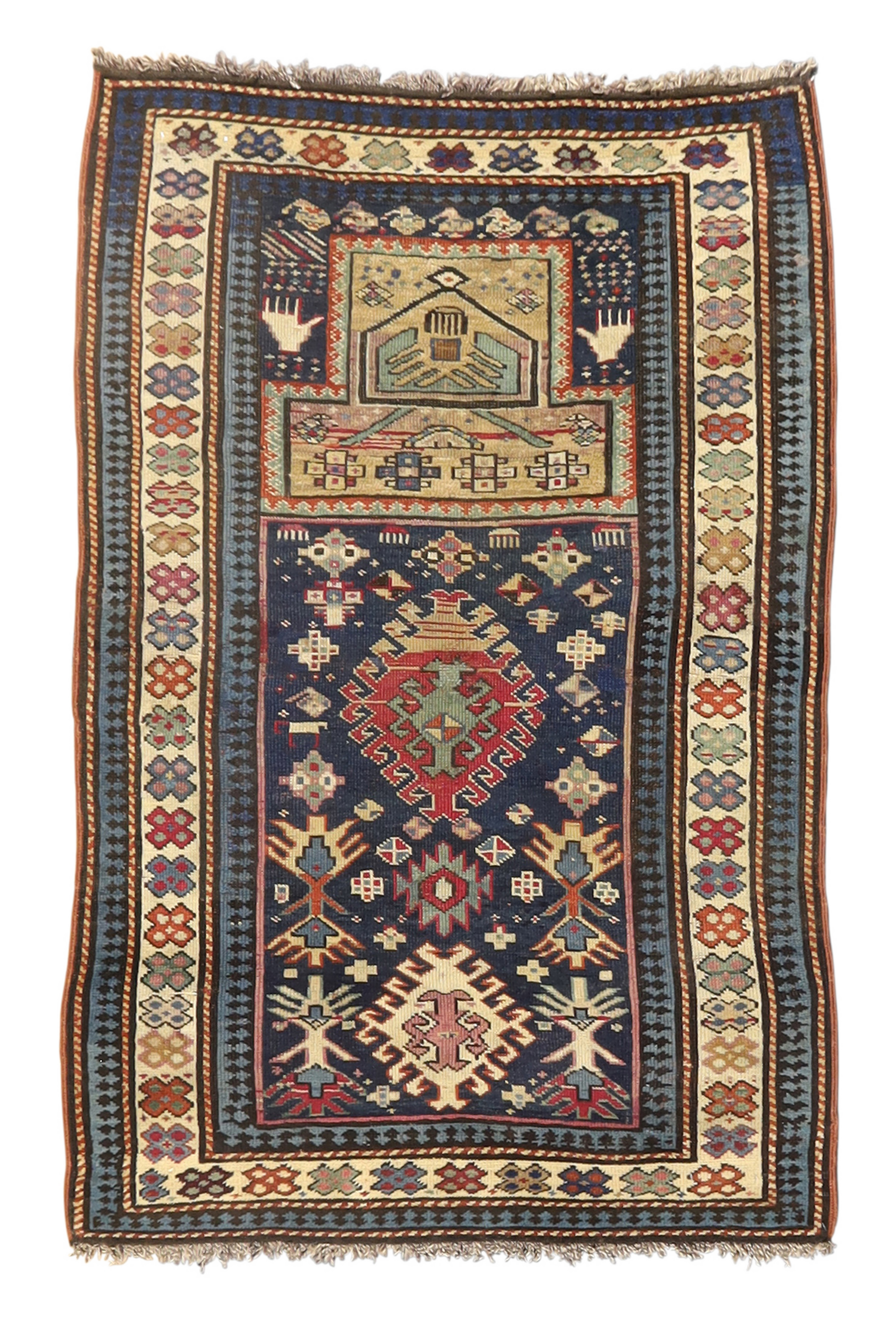 A Karabagh prayer rug, first quarter 20th century, the central mihrab field with geometric motifs...