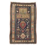 A Karabagh prayer rug, first quarter 20th century, the central mihrab field with geometric motifs...