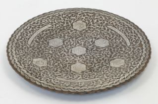 A copper-alloy silver overlaid shallow footed dish, Iran, first half 20th century, the well with ...