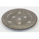 A copper-alloy silver overlaid shallow footed dish, Iran, first half 20th century, the well with ...