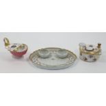 A Derby porcelain inkstand, c.1780-1800, of shell form with swan neck handle and footed base, pai...