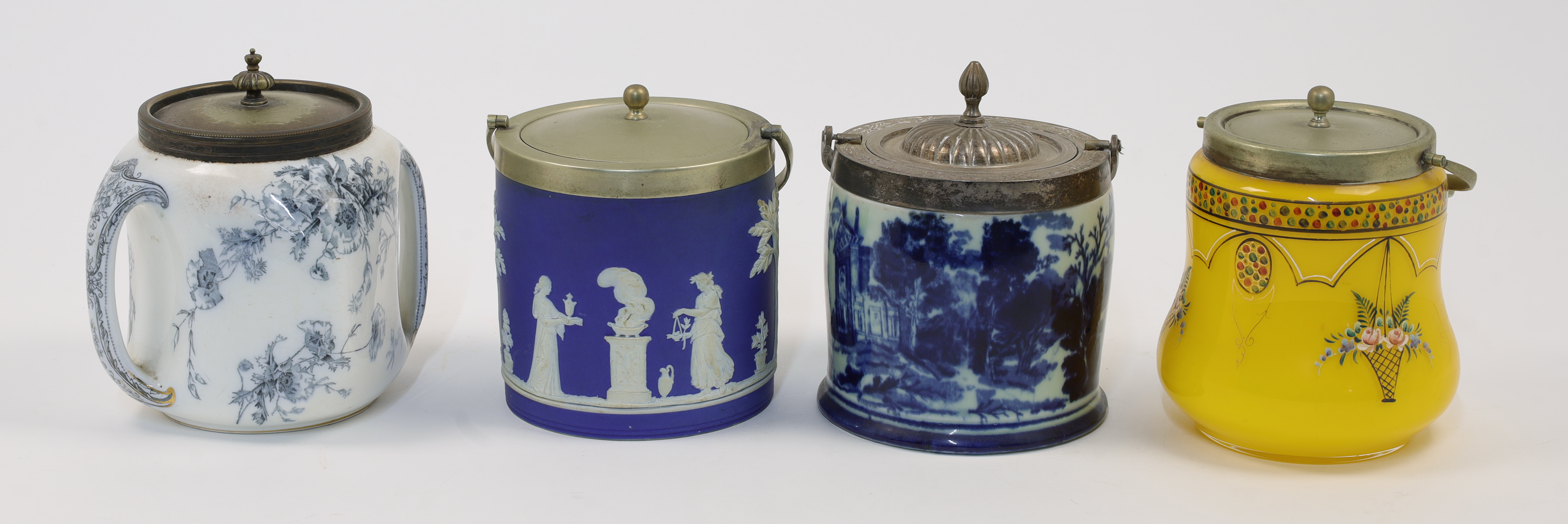 Four biscuit barrels, 19th - 20th centuries, to include a Wedgwood blue jasperware example of cyl...