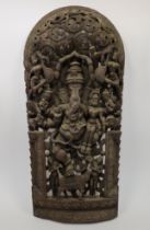 A large carved hardwood sculpture of Ganesha, 20th century, depicted standing on one leg, riding ...