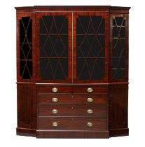 A late George III ebony inlaid mahogany library bookcase, first quarter 19th century, with canted...