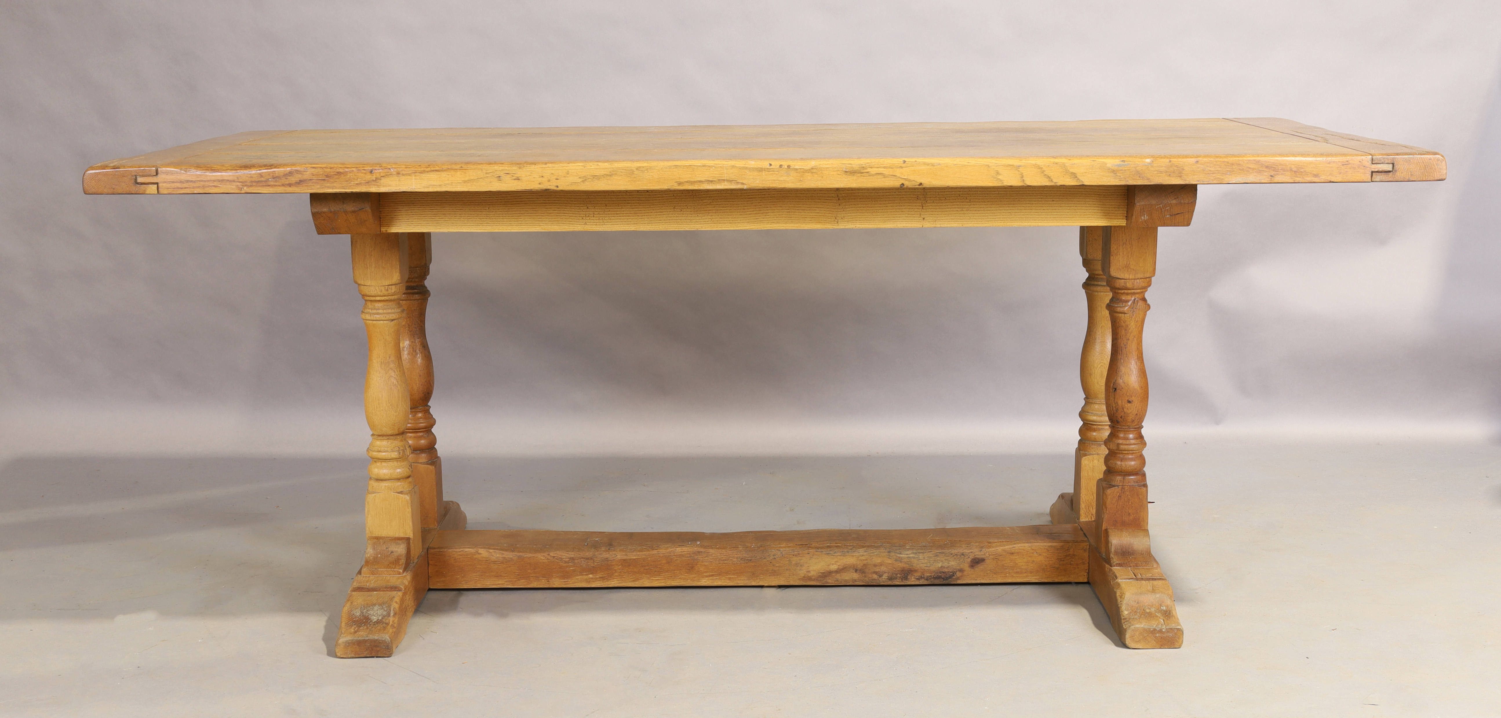 An English elm refectory table, late 19th/early 20th century, the plank top on turned legs to pla... - Image 2 of 3