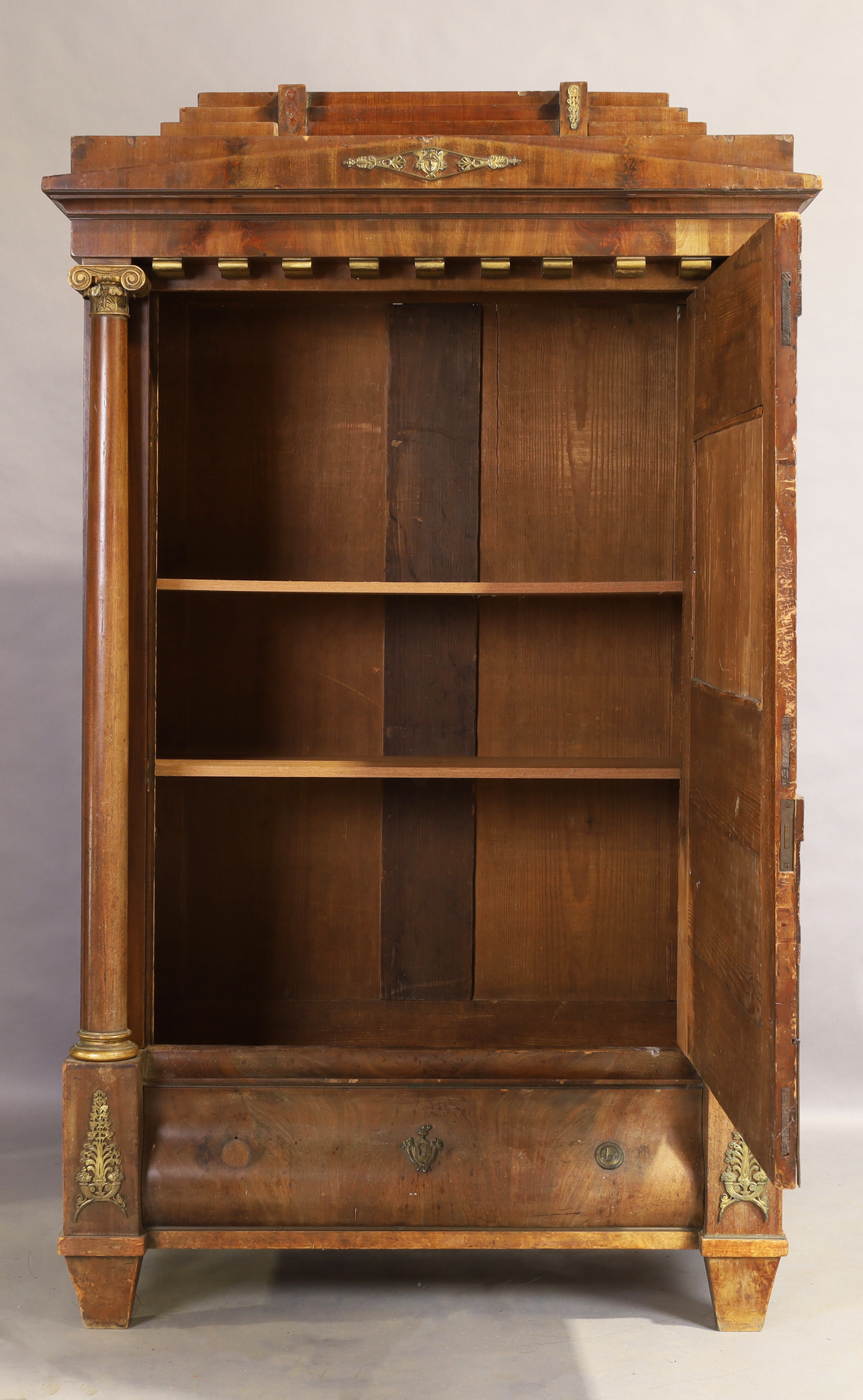 An Empire mahogany cabinet, first quarter 19th century, gilt metal mounted, the stepped and shape... - Image 2 of 2