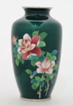 A Japanese enamel baluster vase, 20th century, decorated with sprays of pink roses, on green grou...