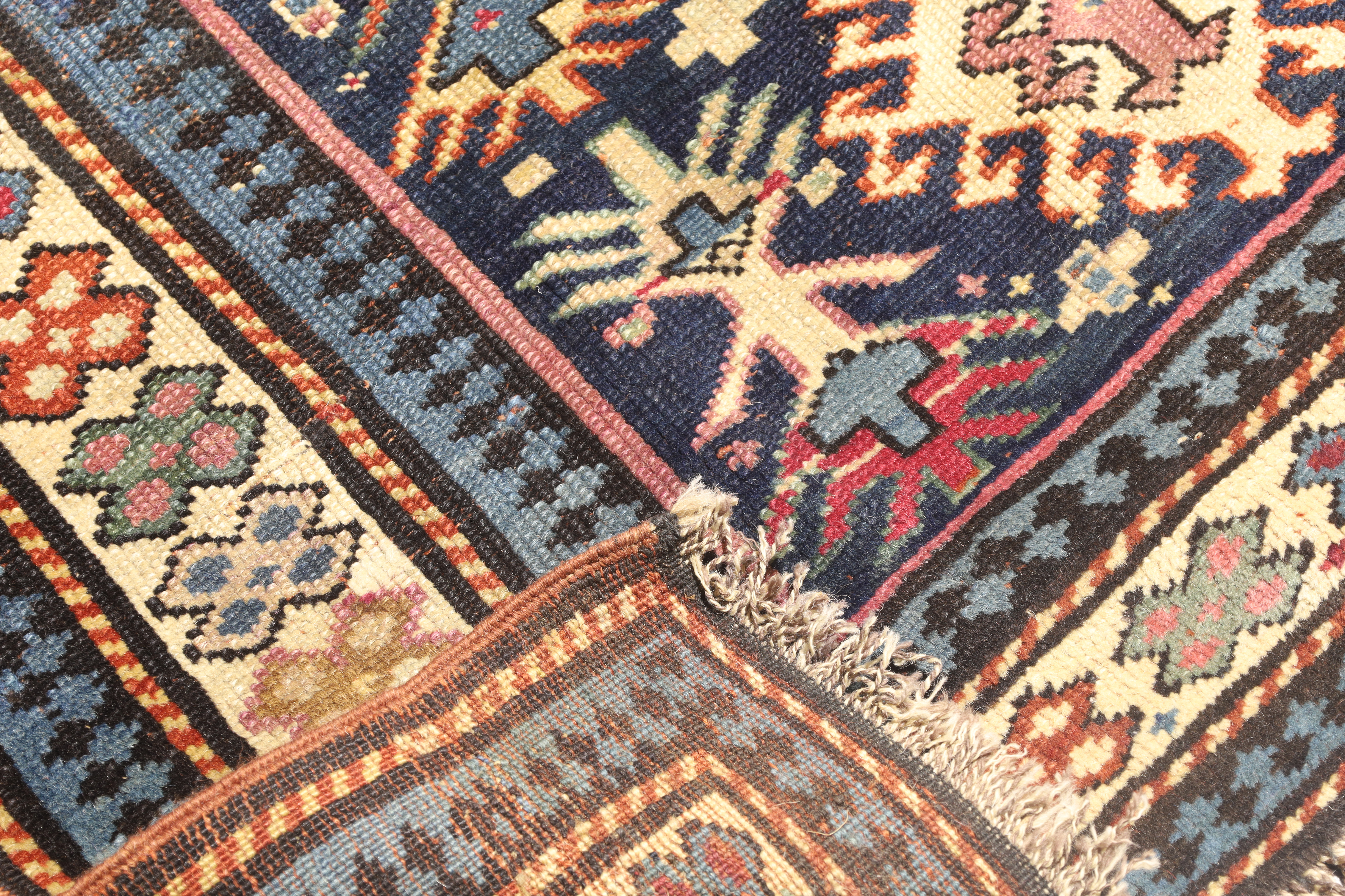 A Karabagh prayer rug, first quarter 20th century, the central mihrab field with geometric motifs... - Image 4 of 4