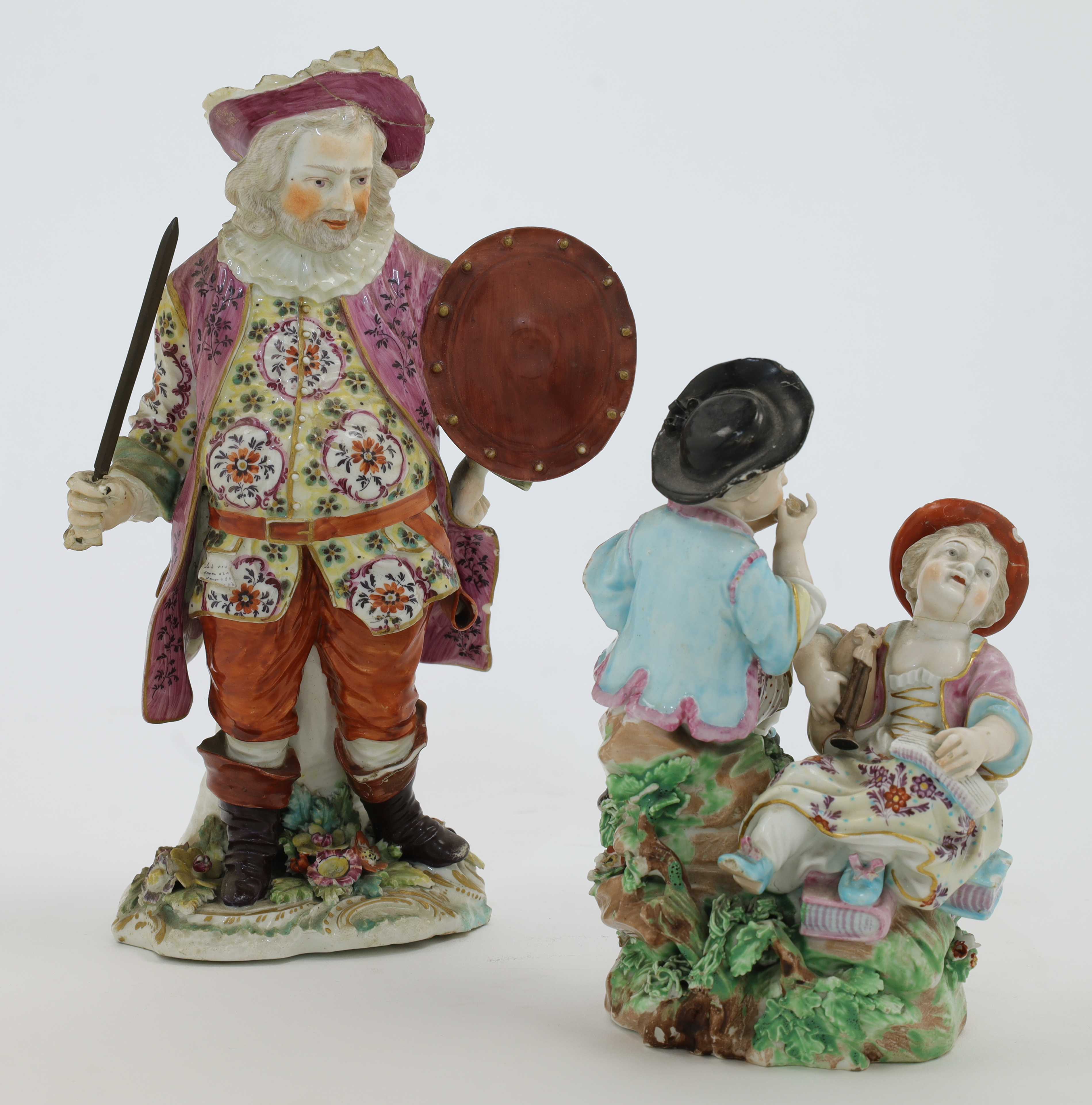 A Derby porcelain figure of James Quinn as Falstaff and a Derby porcelain group of infant rustic ...