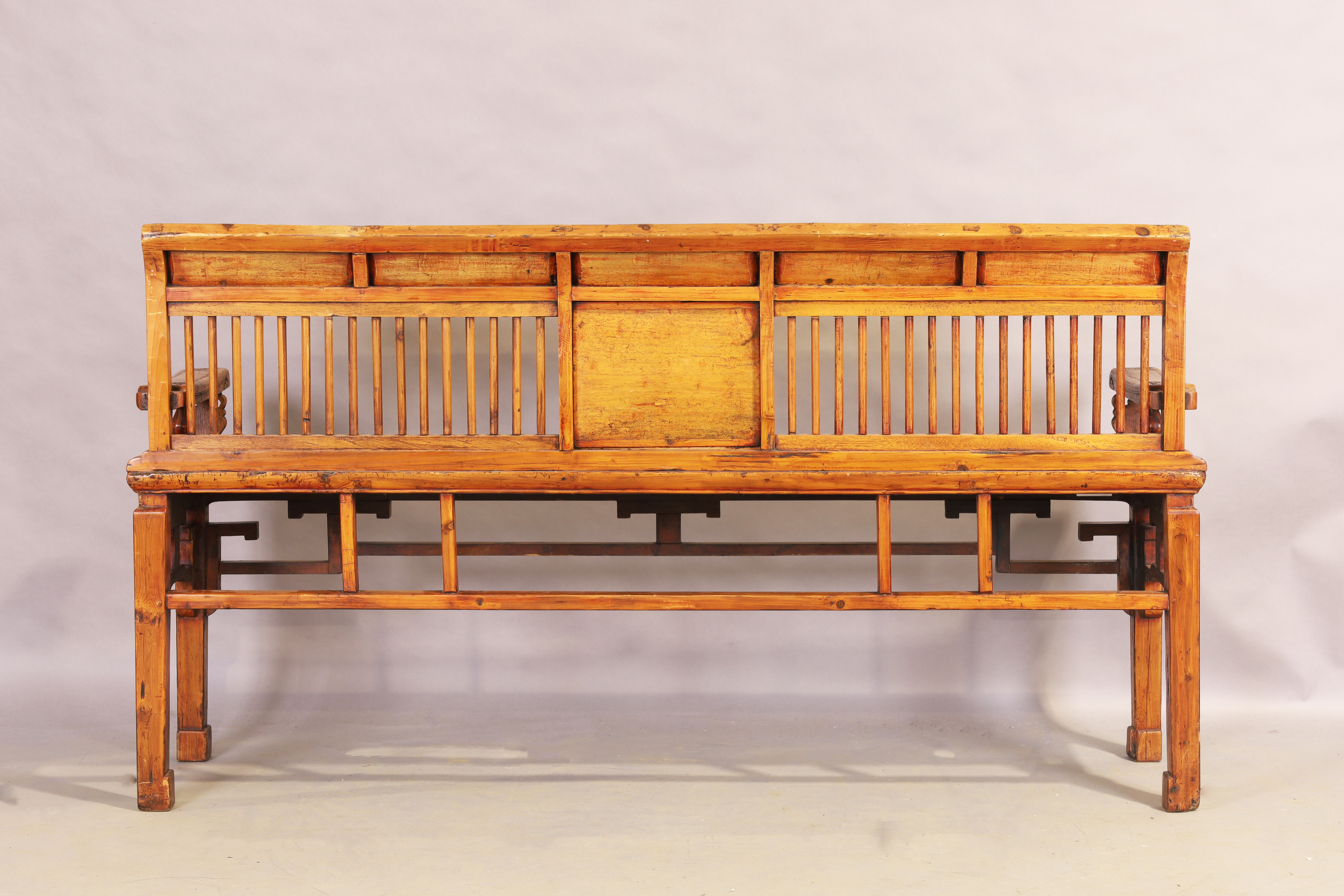 A Chinese hardwood bench, first quarter 20th century, the stick back with carved panels and part ... - Image 2 of 2