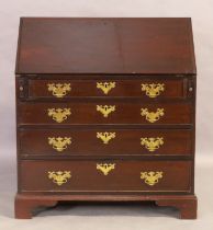 A George III mahogany bureau, first quarter 19th century, the fall front with fitted interior abo...