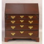 A George III mahogany bureau, first quarter 19th century, the fall front with fitted interior abo...