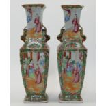 A pair of Chinese Canton famille rose square baluster vases, late 19th century, painted with rese...