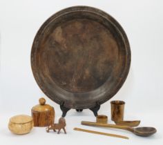 A group of treen, 19th - 20th centuries, comprising a large reeded bowl, 46cm diameter, a figure ...