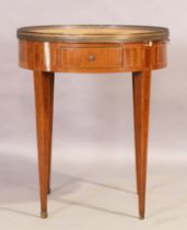A French inlaid kingwood centre table, first quarter 20th century, the suede top with pierced bra...
