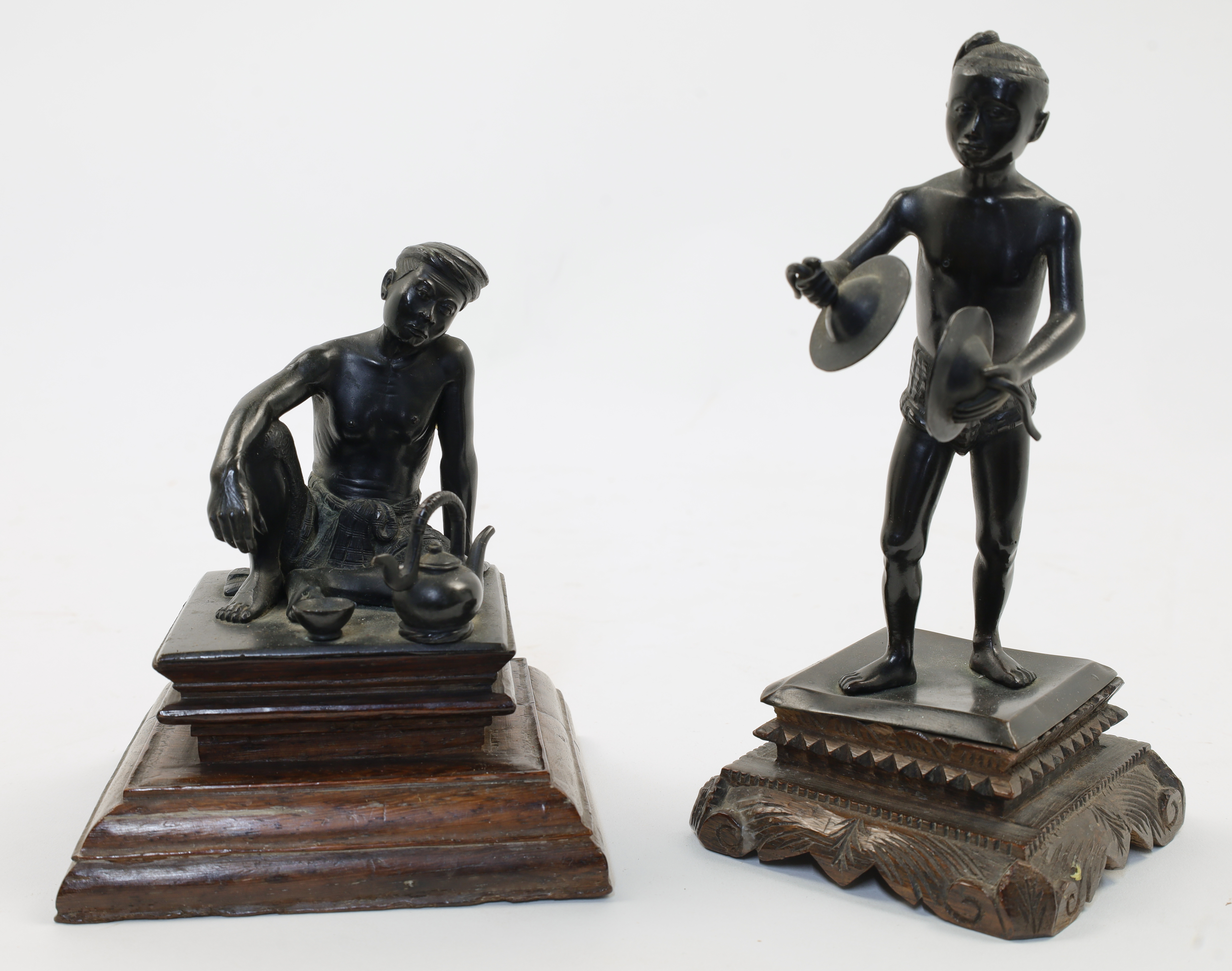 Two Thai bronze figures, late 19th century, the first depicting a standing boy playing the cymbal...