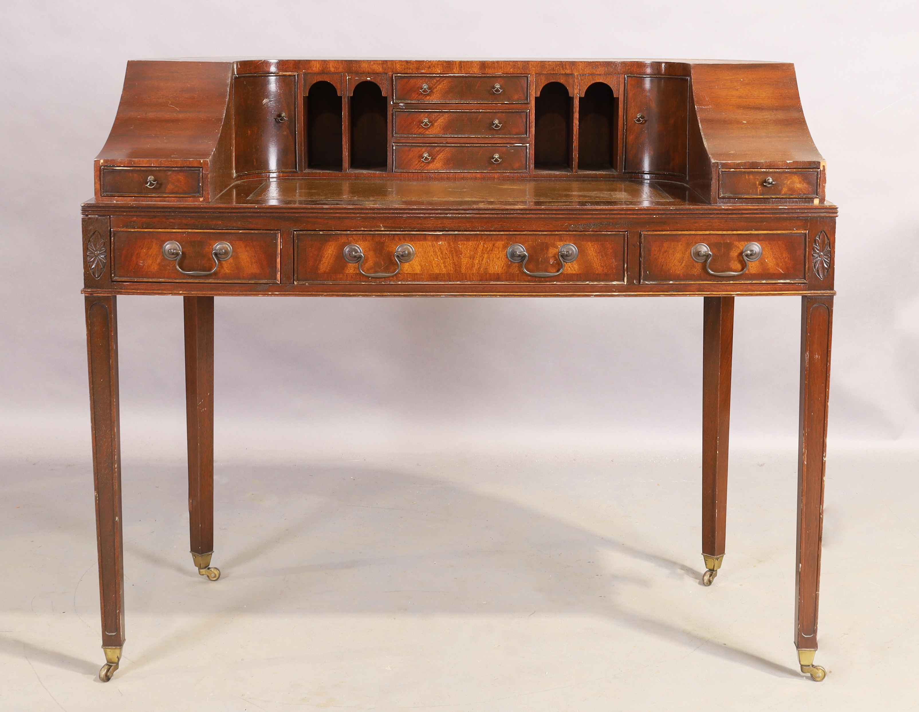 An English mahogany Carlton house desk, of George III style, 20th century, 97cm high, 116cm wide,...