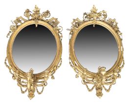 A pair of French giltwood and gesso girandoles, second quarter 19th century, the moulded oval fra...