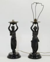 A matched pair of bronzed spelter figural lamps, second half 19th century, each modelled as a cla...