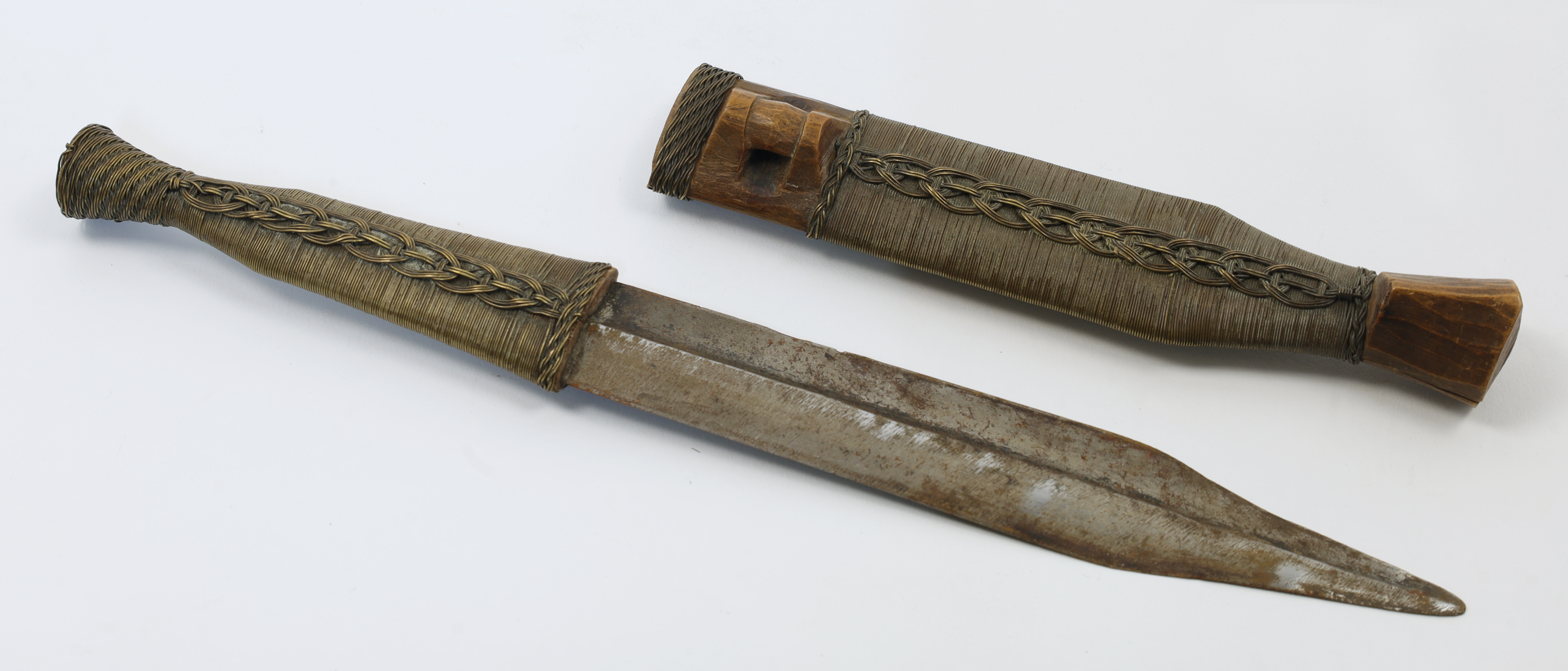 A Shona Bakatwa dagger, Zimbabwe, early 20th century, the straight double-edged blade tapering to...