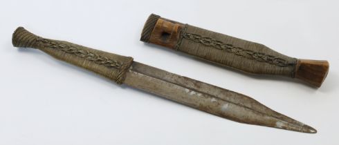 A Shona Bakatwa dagger, Zimbabwe, early 20th century, the straight double-edged blade tapering to...