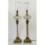 A pair of Victorian oil lamps by Hinks & Son converted for electricity, with cut-glass reservoirs...