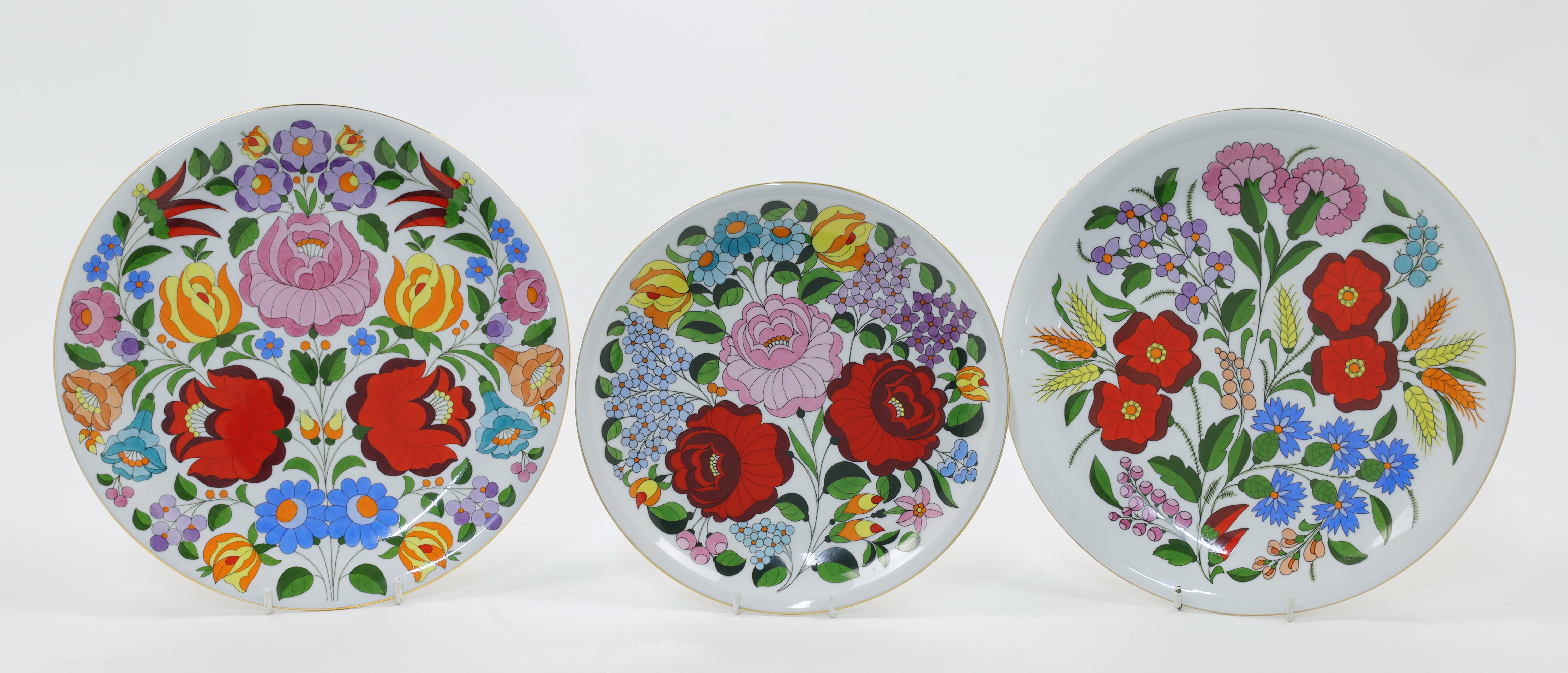 Three Kalocsa porcelain cabinet plates, Hungary, 20th century, blue printed marks, hand-painted w...