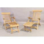 A pair of weathered teak sun loungers by Laidlays (2)