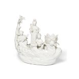 A Chinese blanc de chine candle holder, 20th century, in the form of ladies travelling on a raft ...