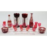 A group of coloured glassware, 19th century, comprising: a pair of ruby glass lustres with clear ...