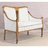 An Edwardian inlaid mahogany salon suite, first quarter 20th century, comprising of settee and fo...