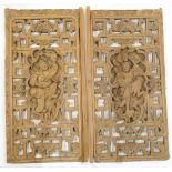 A pair of Chinese high-relief carved panels, 20th century, each with central cartouche of a danci...