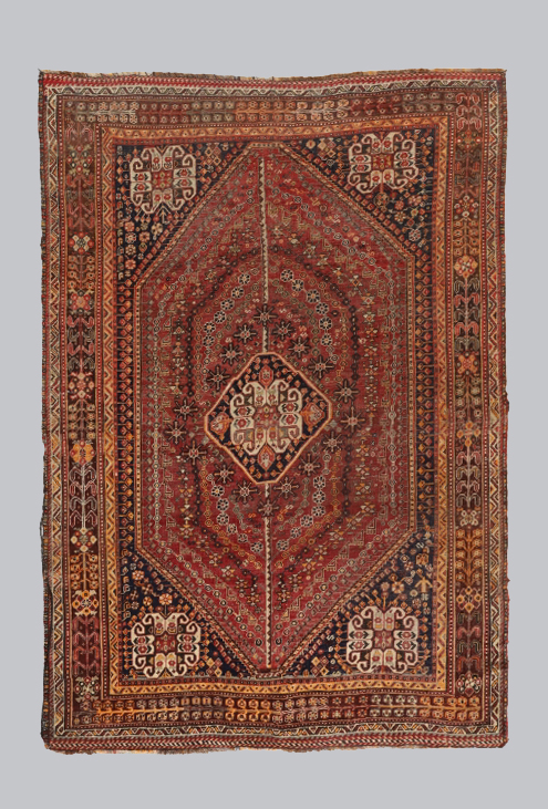 A Persian Qashqai carpet, third quarter 20th century, the central diamond medallion surrounded by...