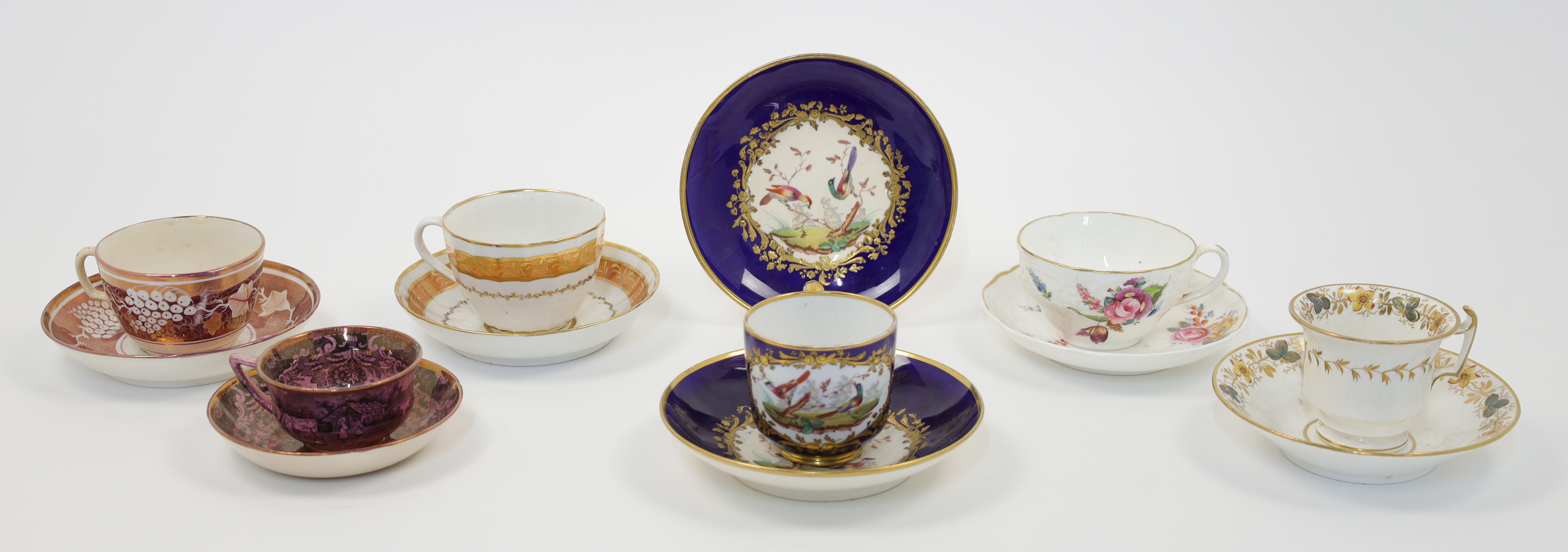 A group of English porcelain teacups and saucers, 19th century, comprising: a Bloor Derby teacup ...