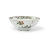 A Chinese famille verte 'floral' bowl, Qing dynasty, Kangxi period, enamelled and gilt to the ext...