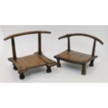 Two hardwood low chairs, African or Chinese provincial, 19th century, each with shaped rail on tw...