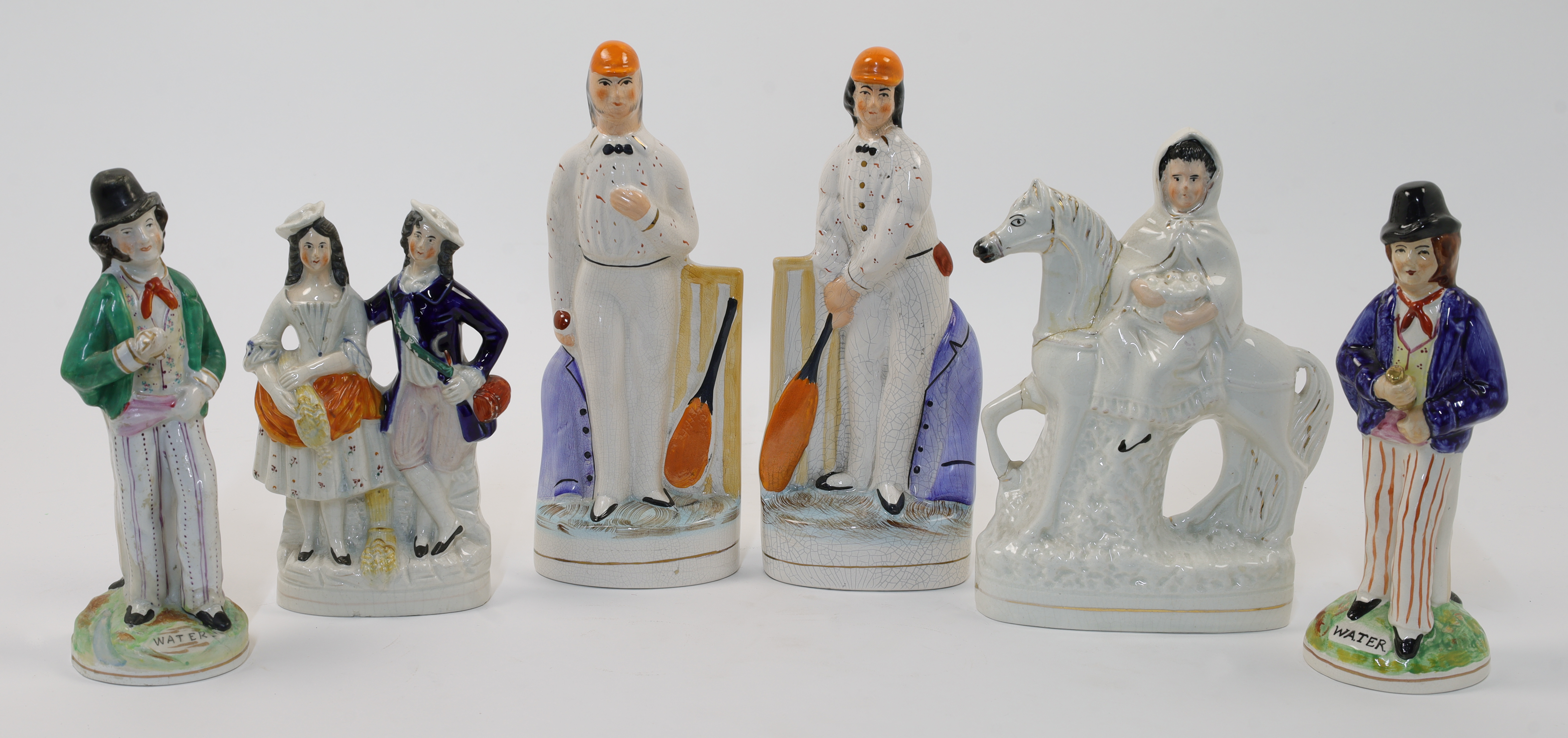 A group of Staffordshire ceramic figures, 19th century, comprising: two double-faced "Gin" and "W...