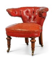 An early Victorian walnut and red leather wingback reading chair, third quarter 19th century, the...
