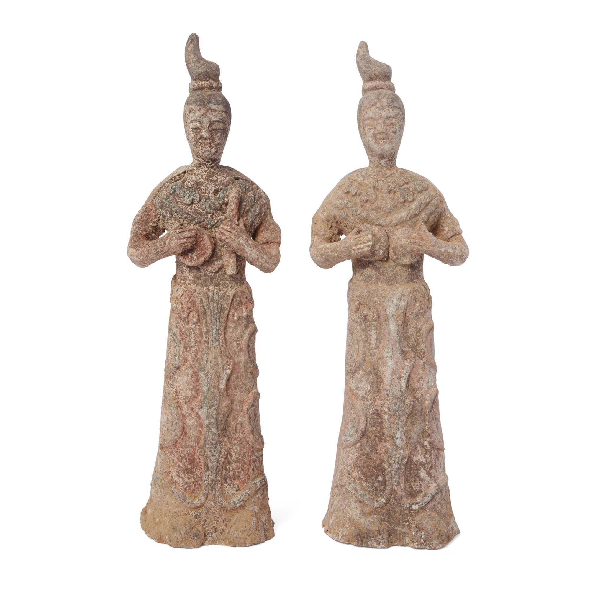 Two Chinese pottery figures of female court musicians, Tang dynasty, each modelled standing clutc...