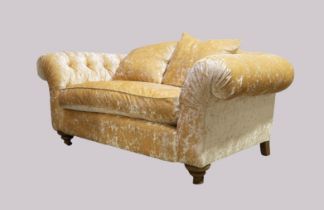 A modern John Sankey chesterfield sofa, with beige chenille velour upholstery, on turned front fe...