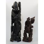 Two Chinese carved hardwood figures, 20th century, the first depicting Shoulao with inset eyes, w...