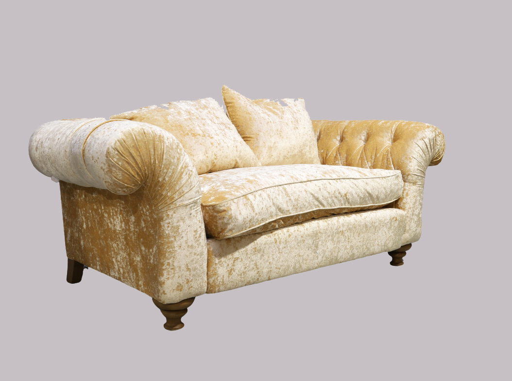 A modern John Sankey chesterfield sofa, with beige chenille velour upholstery, on turned front fe...